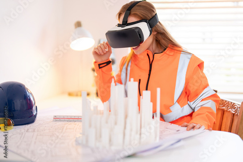 Woman surveyor engineer Construction professional using virtual reality technology for project visualization and planning indoors photo