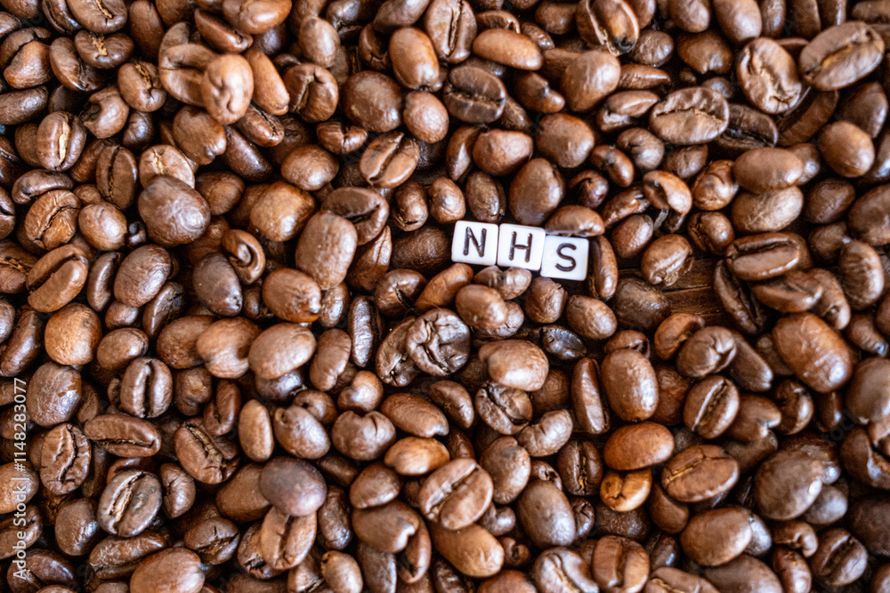 Fototapeta premium NHS written on coffee beans