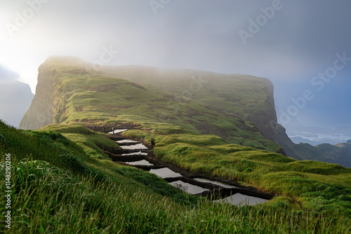 Multiple water cistern seen along with clouds at Kulang fort, Bhandardara, Nashik
