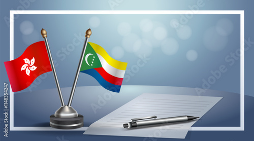 Hong Kong and Comoros National flags on small table with bokeh background, cooperative relationship