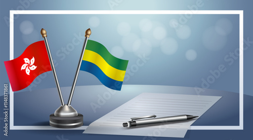 Hong Kong and Gabon National flags on small table with bokeh background, cooperative relationship