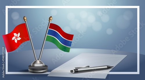 Hong Kong and Gambia National flags on small table with bokeh background, cooperative relationship