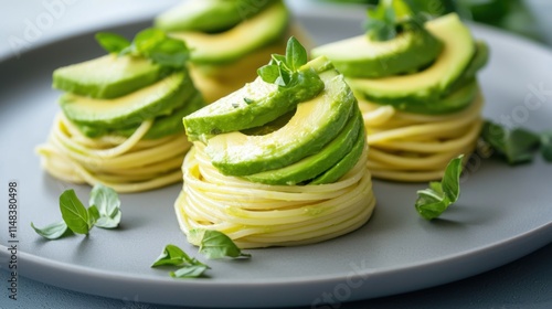 A stylish plate of pasta topped with fresh avocado slices and herbs, showcasing a fusion of flavors and an appealing presentation.