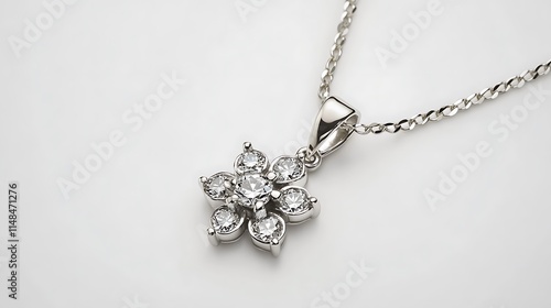 Elegant white gold necklace with diamond pendant, on a plain white background.