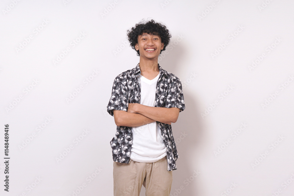 young travel man smiling and standing with arms crossed, isolated on white background young travel man smiling and standing with arms crossed, isolated on white background