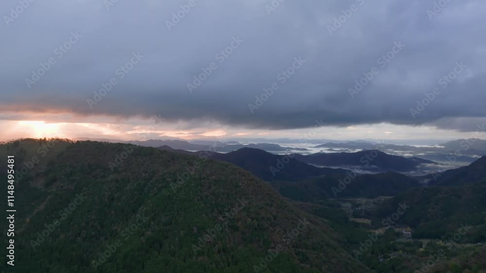 Beautiful sunrise with distant morning fog in mountain landscape. aerial view Beautiful sunrise with distant morning fog in mountain landscape. aerial view