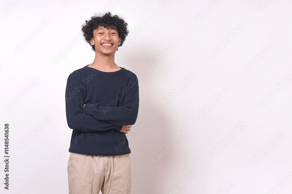 young man smiling in blue sweater standing with arms crossed, businessman on white background young man smiling in blue sweater standing with arms crossed, businessman on white background
