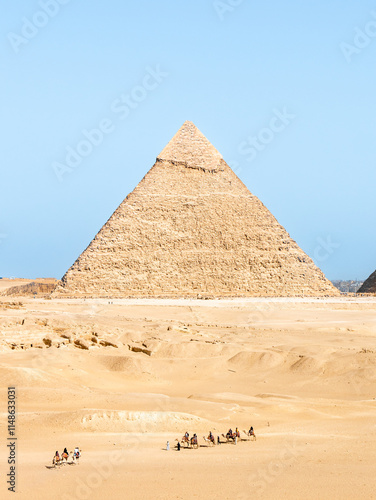 Pyramid of Khafre in Egypt with camels in the foreground on a sunny afternoon