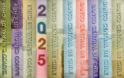 Obraz na płótnie 2025 in Chilean peso. Chile money, Banknotes arranged in the symbol of 2025, Concept, financial and economic analysis of Chile. close up, Business background, flat lay w salonie