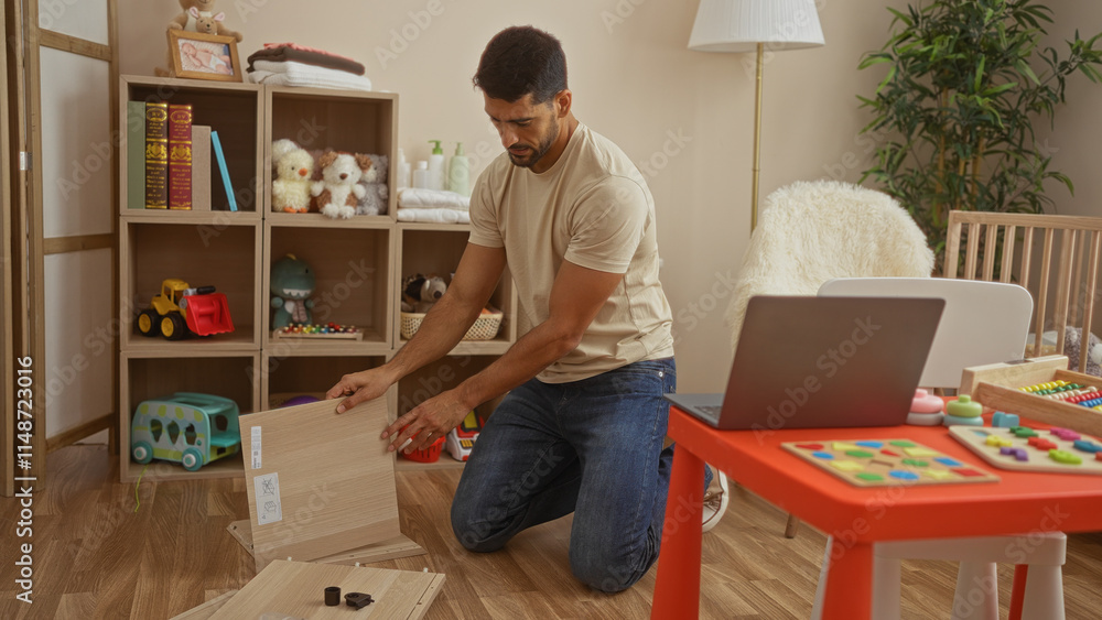 Young man assembling furniture in a child-friendly bedroom with toys and a cradle visible, suggesting a nurturing home environment with colorful decor and modern elements. Young man assembling furniture in a child-friendly bedroom with toys and a cradle visible, suggesting a nurturing home environment with colorful decor and modern elements.