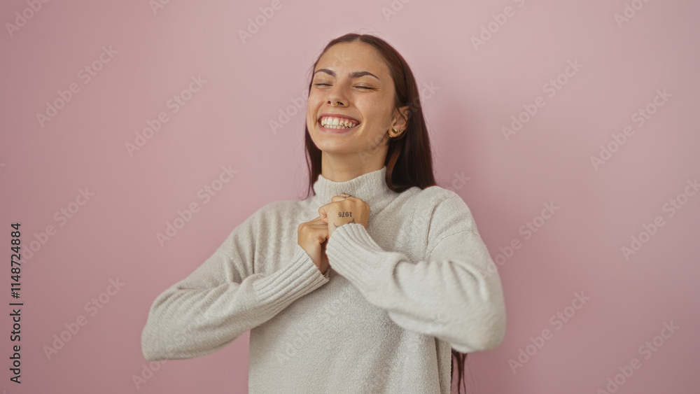 Beautiful young hispanic woman with brunette hair smiling joyfully against isolated pink background Beautiful young hispanic woman with brunette hair smiling joyfully against isolated pink background
