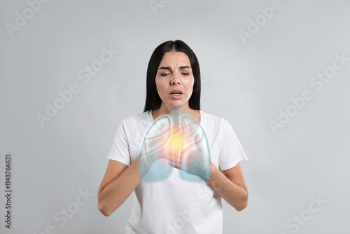 Tablou pe pânză Woman with asthma suffering from difficulty breathing on grey background