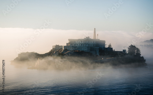 Island fortress shrouded in morning mist. photo