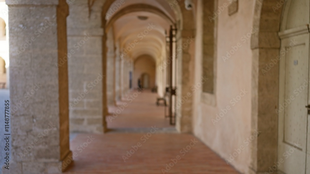 Blurred image of a historic university campus hallway with arched architecture, showcasing an outdoor academic setting in soft, defocused focus. Blurred image of a historic university campus hallway with arched architecture, showcasing an outdoor academic setting in soft, defocused focus.