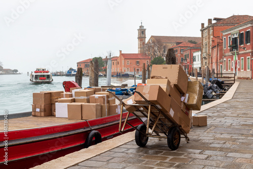Boat Loading Packages for Maritime Transport un Murano, Venice Skyline Italy