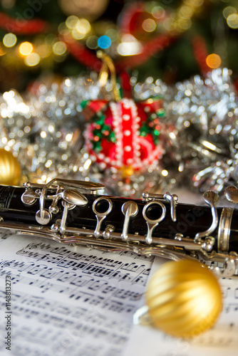 a clarinet with a christmas tree backgound