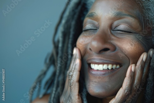 Happy mature woman embracing beautiful melanated skin while aging gracefully. photo