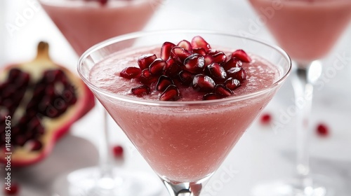 Refreshing Pomegranate Cocktail in Elegant Glasses photo