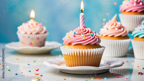 Single cupcake with colorful frosting and lit candle