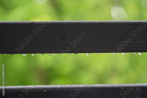 Dew drops on wooden slats very close up photo