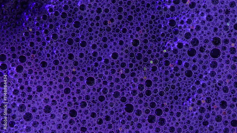 Close up view of foam bubbles burst. Time lapse. Neon glow. The backlight shimmers with colors.
Abstract background Close up view of foam bubbles burst. Time lapse. Neon glow. The backlight shimmers with colors.
Abstract background