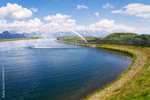 Idyllic summer landscape with pond on Wildenkarkogel Mountain in Alps, Saalbach-Hinterglemm, Zell am See district, Salzburg federal state, Austria photo