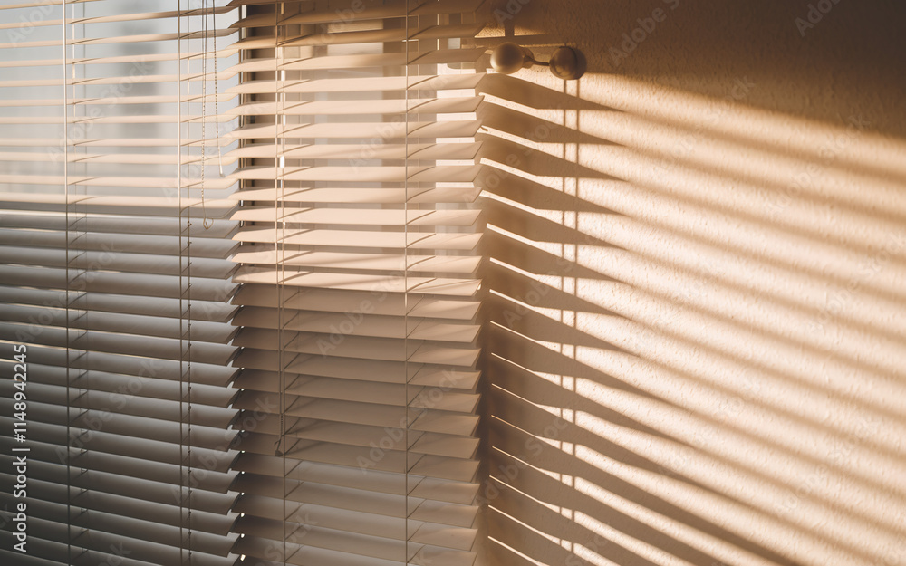 Sunlight Through Blinds , Sunlight streams through slightly opened window blinds, casting warm shadows on wall.