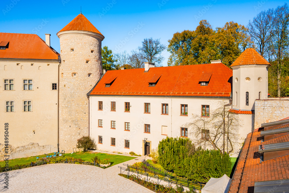 View of Pieskowa Skala castle in park with autumn fall colors of trees in Ojcow National Park, Poland