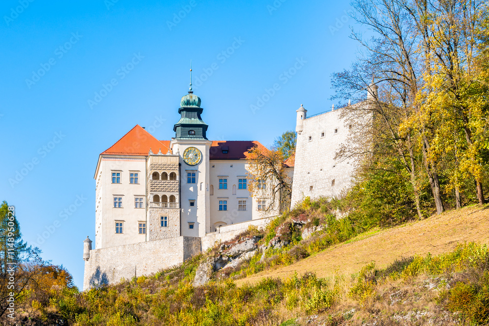 View of Pieskowa Skala castle in park with autumn fall colors of trees in Ojcow National Park, Poland