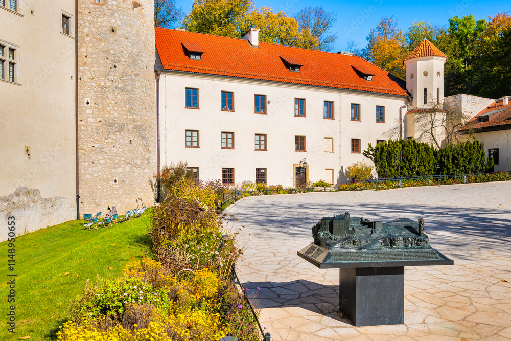 View of Pieskowa Skala castle in park with autumn fall colors of trees in Ojcow National Park, Poland