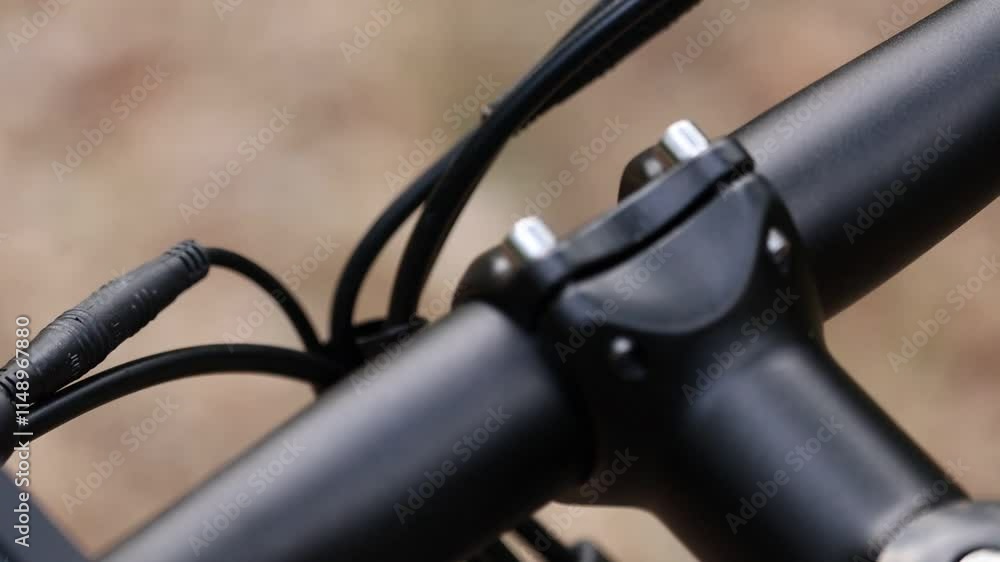 Close-up of a bicycle handlebar with visible brake levers.
