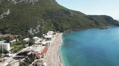 Aerial video of golden beaches meet turquoise Adriatic sea in town of Canj, Montenegro photo