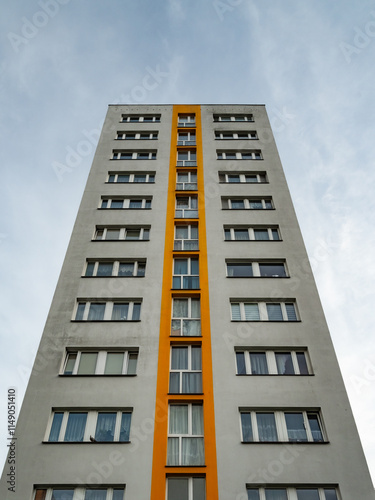 A block of flats with gray and orange elevation photo