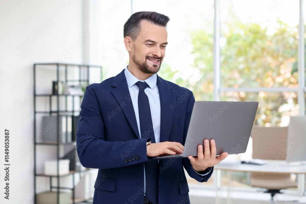 Smiling banker working with laptop in office Smiling banker working with laptop in office