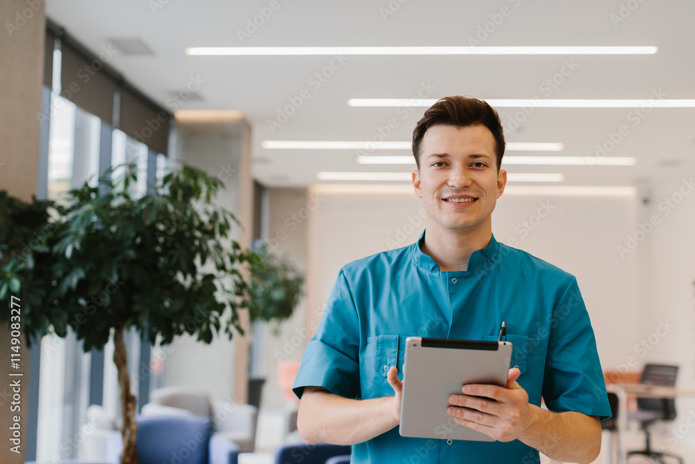 Young doctor holding a tablet and looking at the camera in a modern clinic. Young doctor holding a tablet and looking at the camera in a modern clinic.