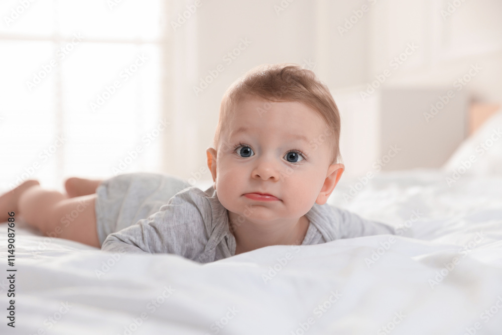 Cute little baby on bed at home Cute little baby on bed at home