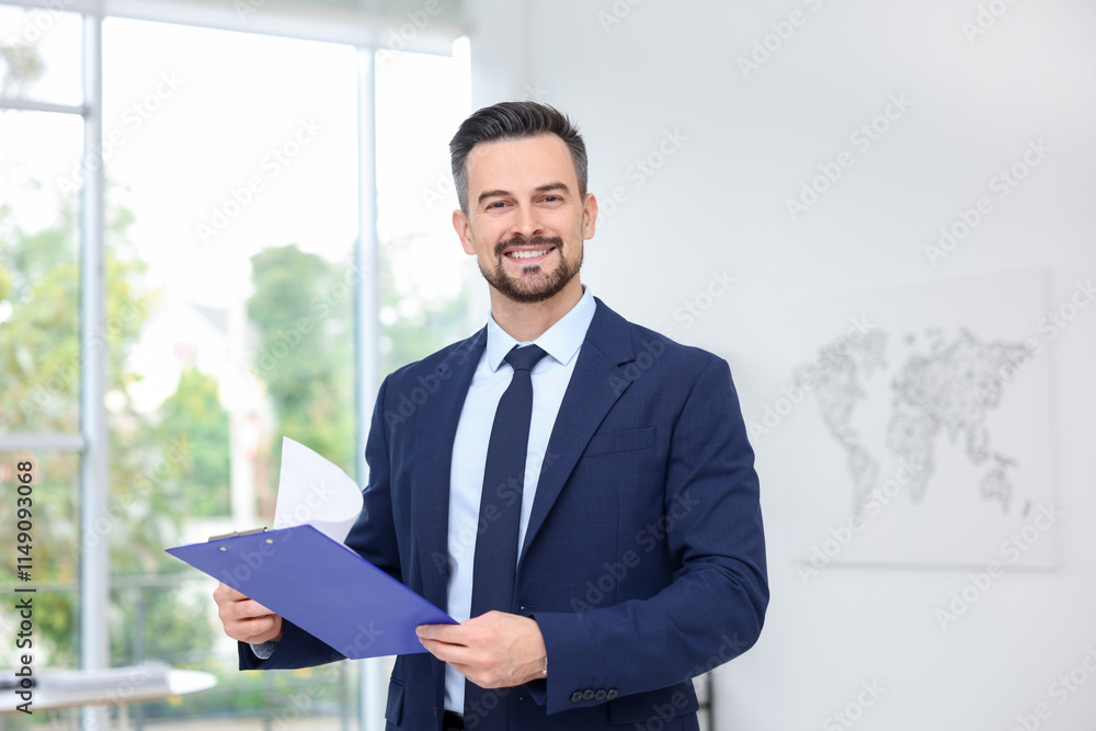 Portrait of smiling banker with clipboard in office Portrait of smiling banker with clipboard in office