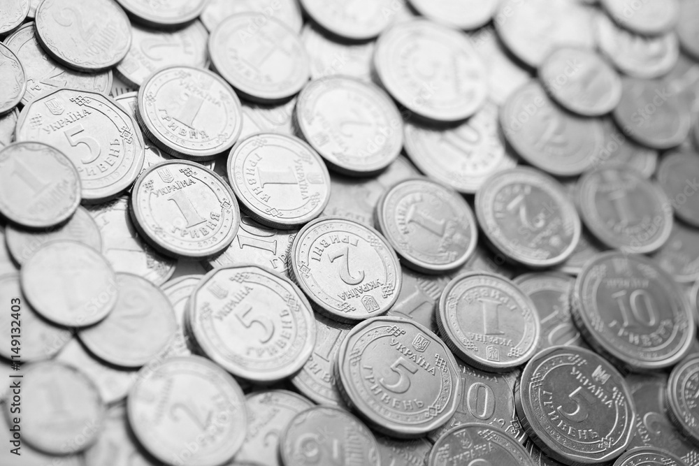 Ukrainian money, exchange coin, white coins of different denomination in random order.