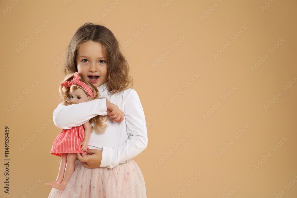 Cute little girl with doll on beige background. Space for text Cute little girl with doll on beige background. Space for text