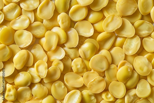 Photo of Big amount of yellow raw fava beans. Food photo for backdrops or recipes