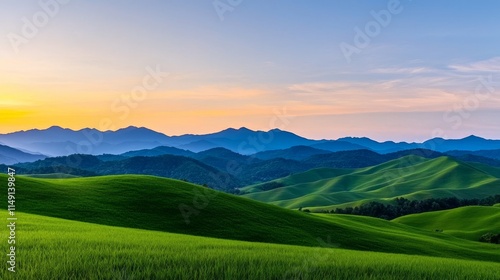 A serene landscape featuring rolling green hills under a colorful sky at sunset, mountains in the distance enhancing the tranquil atmosphere.