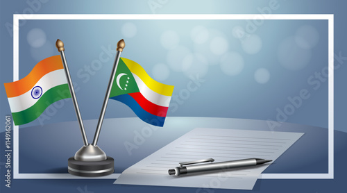 India and Comoros National flags on small table with bokeh background, cooperative relationship
