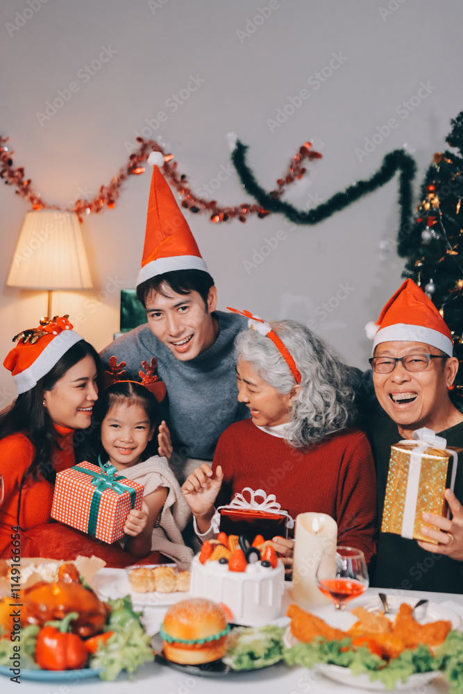 Happy family with gifts celebrating Christmas together Happy family with gifts celebrating Christmas together
