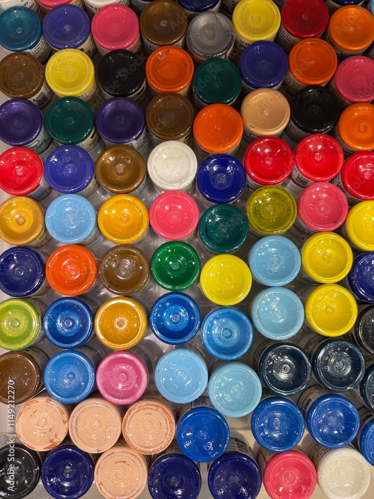 vibrant background made from an artistic arrangement of colorful bottles, showcasing vivid hues, transparency, and a play of light, creating a lively and creative visual effect.