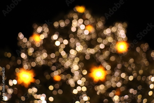 Out of focusHuge Christmas Tree with light stars on 