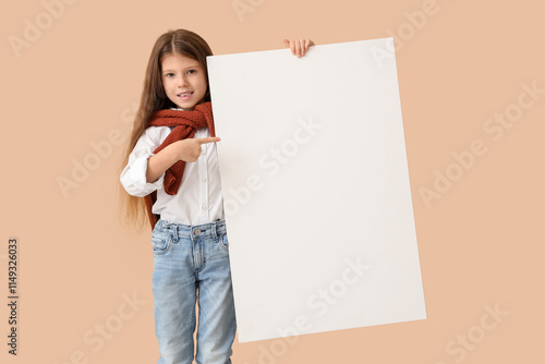 Cute little girl pointing a...