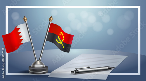 Bahrain and Angola National flags on small table with bokeh background, cooperative relationship