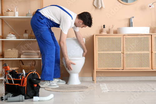 Male plumber with tool bag ...