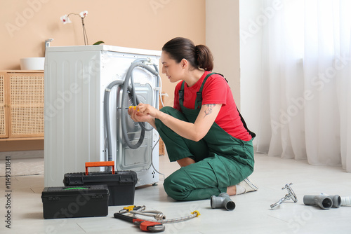 Female plumber with screwdr...