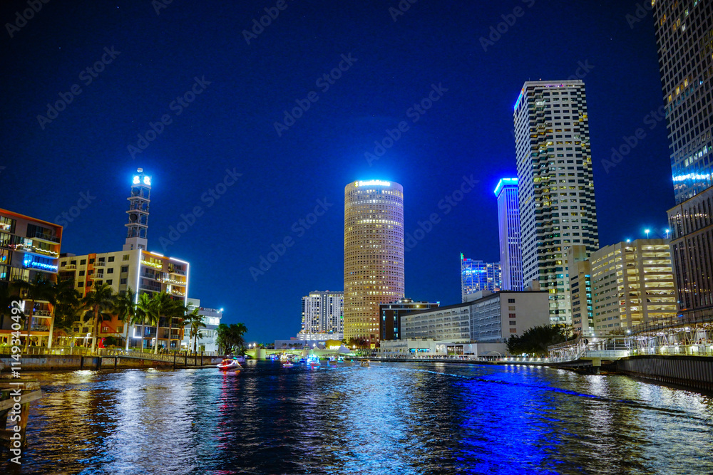 Fototapeta premium Tampa, Florida USA - Dec 01, 2024: Lighted boat parade show in Tampa downtown and riverwalk